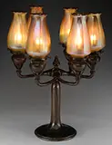 Tiffany Studios, 6-Arm Candelabra, Each electrified candle cup houses a gold favrile vertically ribbed candle shade