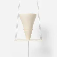Elsa Rady, Cycladic Swing No. 7, 2005, porcelain, Corian, titanium-plated brass, stainless steel wire, plumb bob