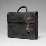 Marilyn Levine, Hanging Black Briefcase with Missing Strap, 1983, hand-built and glazed stoneware, metal
