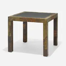Occasional table by Paul Evans, c. 1975, patinated pewter, copper, and bronze, slate, sold Aug 2023