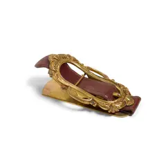 Oversized Paper Clip by Hermès, leather, gold-plated brass, impressed signature to brass 'HERMES PARIS' and stamped to leather 'HERMES', offered Oct 2021