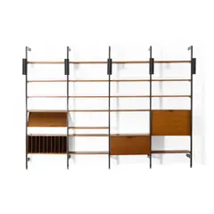 Comprehensive Storage System (CSS) by George Nelson & Associates, for Herman Miller, walnut, enameled aluminum, aluminum, and enameled steel, sold Oct 2021