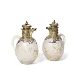Pair of Ewers by Cristallerie Daum, overlaid, etched and gilt-decorated glass, vermeil, each signed 'Daum Nancy' with cross of Lorraine in gilt enamel on un, sold Jul 2021