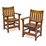 Pair of 'V' Back Armchairs by Gustav Stickley, oak, leather, one with Craftsman Workshops paper label, sold Jul 2021