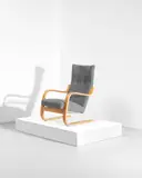 Early cantilevered highbacked armchair, model no. 36/86, designed 1935 by Alvar Aalto, Bent birch laminated plywood, fabric upholstery, sold Oct 2021