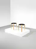 Pair of 'Fan leg' stools, model no. X602, designed 1954 by Alvar Aalto, Birch, leather, sold Oct 2021