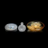 'Cactus' perfume bottle and stopper, 'Volubilis' dish and 'Coquilles' plate, no. 5, designed 1921-1943 by René Lalique, Glass with enamel decoration, opalescent glass, sold Dec 2021