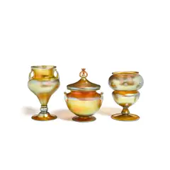 Frederick Carder, Covered Bowl with Two Vases, for Steuben, Aurene glass, each engraved with maker's marks