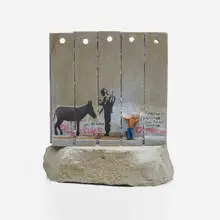 Walled Off Hotel Souvenir by Banksy, 2019, hand-painted resin sculpture with West Bank Separation Wall base, sold May 2024