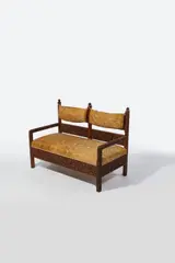 Lockwood de Forest, Sofa, teak, on casters, later silk upholstery, carved by the Ahmedabad Wood Carving Company, Ahmedabad, India