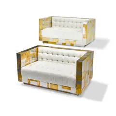 Paul Evans, Pair of Cityscape Settees, for Directional, patchwork chromed metal and brass, leather upholstery, one settee stamped and signed 'AN ORIGINAL Paul Evans'