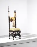 Carlo Bugatti, Rare chair, circa 1905, Walnut, ebonized wood, repoussé copper, brass, pewter, painted parchment, passementerie