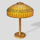 Tiffany Studios, Swirling Leaf Table Lamp, leaded glass, gilt bronze, shade stamped 'TIFFANY STUDIOS NEW YORK 1470', base stamped 'TIFFANY STUDIOS NEW YORK 528'