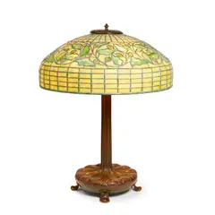 Tiffany Studios, Swirling Oak Leaf Table Lamp, leaded glass, patinated bronze, shade stamped 'TIFFANY STUDIOS NEW YORK 1467', base stamped 'TIFFANY STUDIOS NEW YORK 363'