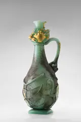 Unique Caraffa Scavo con Testa by Ermanno Nason, for Vetreria Gino Cenedese, opaque pale green scavo glass with applied decoration, gold foil, and applied with handle an, sold Dec 2018