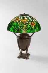 Daffodil Table Lamp by Tiffany Studios, on Acorn Urn base, patinated bronze, leaded glass, shade stamped 'TIFFANY STUDIOS NEW YORK', base stamped 'TIFFANY STUDI, offered Dec 2019