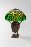 Daffodil Table Lamp by Tiffany Studios, on Acorn Urn base, patinated bronze, leaded glass, shade stamped 'TIFFANY STUDIOS NEW YORK', base stamped 'TIFFANY STUDI, offered Dec 2019