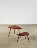 George Nakashima, Wepman and High-Free Form Table, American black walnut, larger table with partial free edge and extensive fissures, each with ink mark 'George Nakashima July 1970'