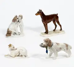 Rosenthal, Vier Hundefiguren, Porzellan, mit farbigem Unterglasurdekor, bzw
