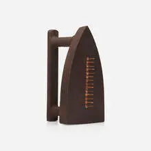 Cadeau by Man Ray, cast iron, steel tacks, sold Jul 2023