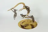 Carla Lavatelli, Down the Slide, Brass and bronze figural table-top kinetic, spring-based sculpture