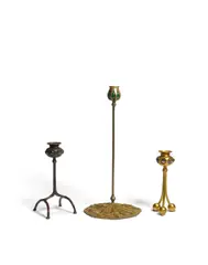 Group of Three Candlesticks by Tiffany Studios, patinated bronze, Favrile glass, each stamped with the firm's marks, sold Oct 2019