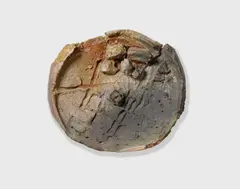 Untitled (Plate) by Peter Voulkos, wheel-thrown ceramic comprised of half-kenosei and half-stoneware clay, the underside signed and dated 'VOULKOS 97', sold Oct 2019