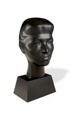 Isamu Noguchi, Bust of Rosita Winston, carved ebony, engraved 'ISAMU', on carved ebony pedestal and red lacquered wood platform (not illustrated)