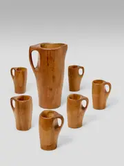 Pitcher and Cups by Alexandre Noll, mahogany, comprising pitcher and six cups, each engraved 'ANOLL', sold Jun 2019