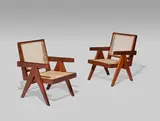 Pair of Easy Chairs by Pierre Jeanneret, teak, cane, together with later upholstered cushions, one example with painted mark 'PSA 84', sold Jun 2019