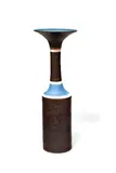 Bottle with Cylindrical Body and Flaring Lip by Lucie Rie, porcelain, golden manganese glaze, with two radiating bands of sgraffito in blue glaze, impressed 'LR', sold Jun 2019