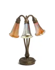 Three-Light Lily Lamp by Tiffany Studios, Favrile glass, patinated bronze, one shade inscribed 'L, sold Apr 2019