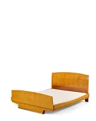Bedstead by Emile Jacques Ruhlmann, amboyna, gilt bronze, branded 'Ruhlmann' to the footboad and headboard, the rail painted, sold Apr 2019