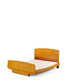 Emile Jacques Ruhlmann, Bedstead, amboyna, gilt bronze, branded 'Ruhlmann' to the footboad and headboard, the rail painted