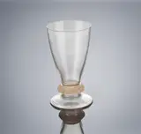 A 'Bague Lézards' Glass, designed in 1912 by René Lalique, clear glass, mould-blown, frosted and polished, sold Feb 2019