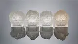 René Lalique, A Set of Four Table Ornaments: Printemps, Été, Automne, and Hiver, clear glass, mould-blown, frosted and polished, one with light sepia staining