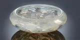 A 'Cyprins' Bowl, designed in 1921 by René Lalique, opalescent glass, mould-blown and polished, shallow form with inverted rim, sold Feb 2019