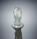 A 'Deux Tourterelles' Paperweight, designed in 1925 by René Lalique, opalescent glass, mould-blown, frosted and polished, sold Feb 2019