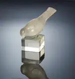 A 'Moineau Sur Socle, Ailes Fermées' Paperweight, designed in 1929 by René Lalique, clear glass, mould-blown, frosted and polished, Marcilhac no, offered Feb 2019