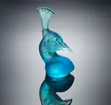 A 'Tête de Paon' Car Mascot, designed in 1928 by René Lalique, blue glass, mould-blown, frosted, polished, and with modern presentation case, offered Feb 2019