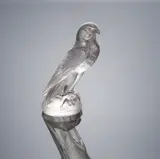 A 'Faucon' Car Mascot, designed in 1928 by René Lalique, the clear glass of amethyst hue, mould-blown, frosted and polished, sold Feb 2019