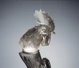 A 'Tête de Coq' Car Mascot, designed in 1928 by René Lalique, clear glass, mould-blown, frosted and polished, sold Feb 2019