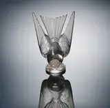 René Lalique, A 'Hirondelle' Car Mascot, designed in 1928, the glass of faint amethyst hue, mould-blown, frosted and polished