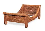 Süe et Mare, 'Draperie': A Day Bed, circa 1925, burr walnut, both stretchers externally carved with a swag-like drape, the bed ends carved with Flemish scrolls to top and bottom