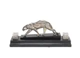 Maurice Prost, A Stylish Art Deco Desk Tidy Panther, circa 1925, silvered bronze and glass, the panther positioned between two hinge-lidded glass inkwells, raised off a black marble plinth with pen tray