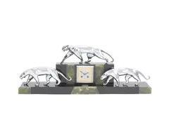 Michel Decoux, An Impressive Art Deco Mantle Clock, circa 1925, the clock case and plinth of black marble and green onyx surmounted with three silvered bronze panthers