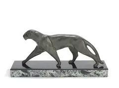 A Art Deco Study of a Striding Panther by Michel Decoux, circa 1925, patinated bronze, its textured body in a green patination, raised off a black and variegated marble plinth, offered Jun 2019
