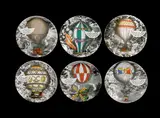 A Six Part Set of 'Mongolfiere' (Hot Air Balloon) Dinner Plates, designed and executed in 1955 by Piero Fornasetti, porcelain applied with transfer design and hand-painted colours, offered Jun 2019