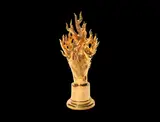 Oriel Harwood, 'Flame Head': A Large Bust, executed 2017, ceramic, modelled as a human head whose hair appears as fierce rising flames, and finished in 24k gold lustre glaze