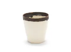 A beaker by Lucie Rie, circa 1960, hand-thrown porcelain with transparent glaze, the outside and inside of the top rim banded in manganese, sold Jun 2019